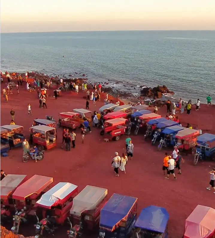 Hormuz Island Tok Tok transportation near colorful mountains